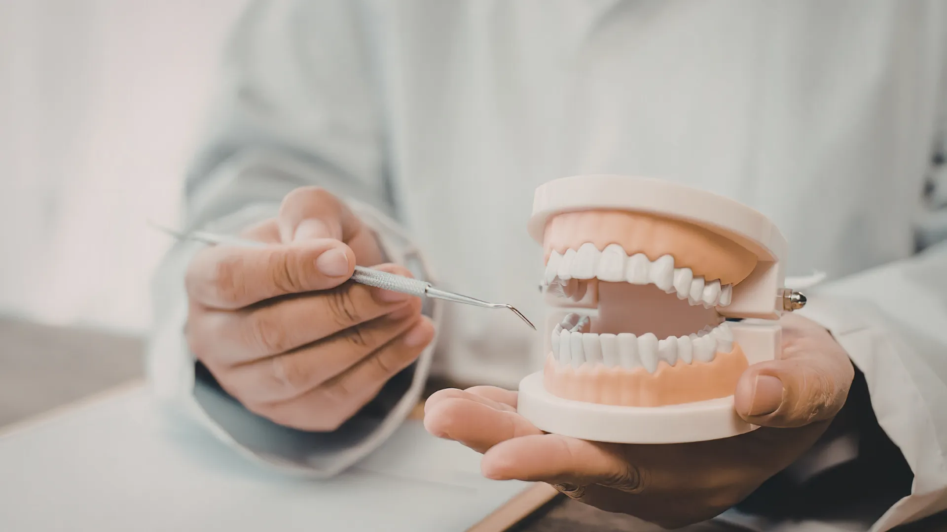 Dentist consulting patient about smoking and dental implants