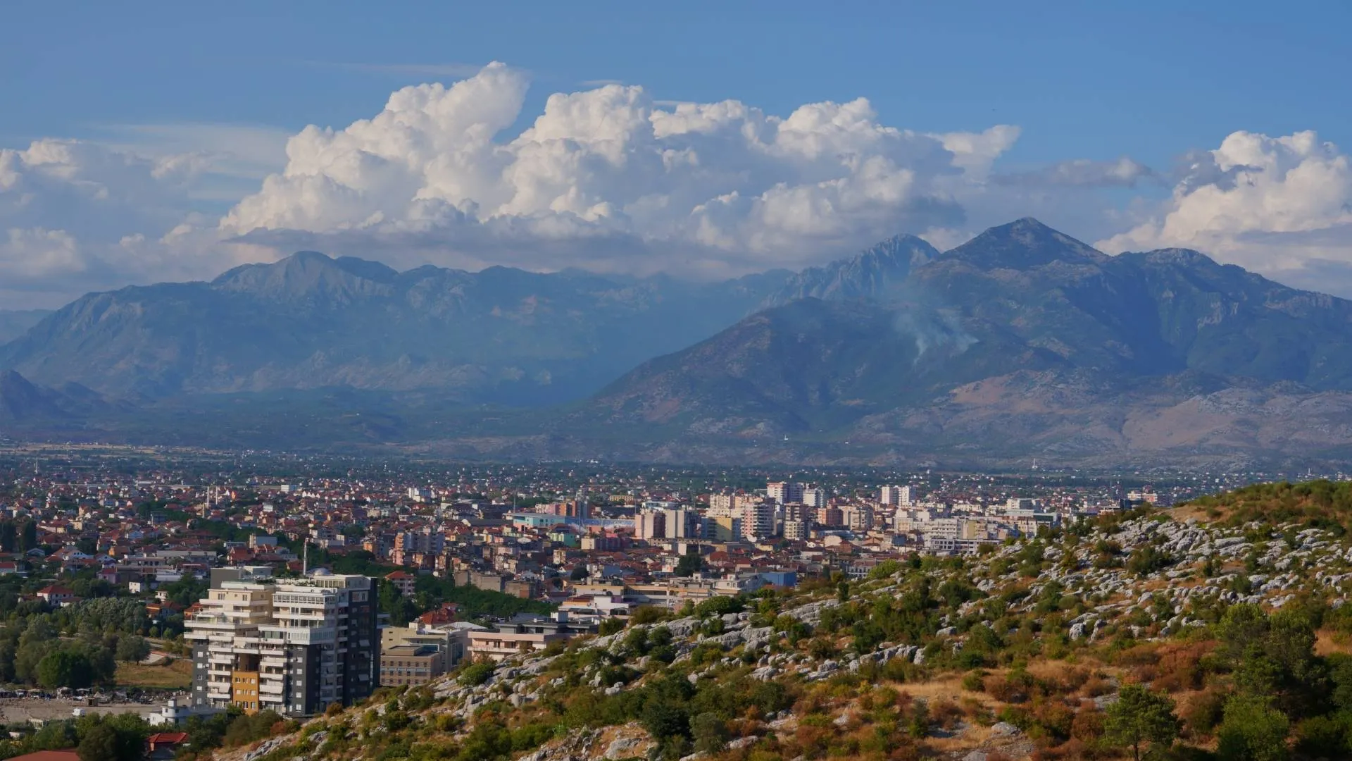 Beautiful landscape of Albania in March with mountains, traditional architecture and early spring scenery